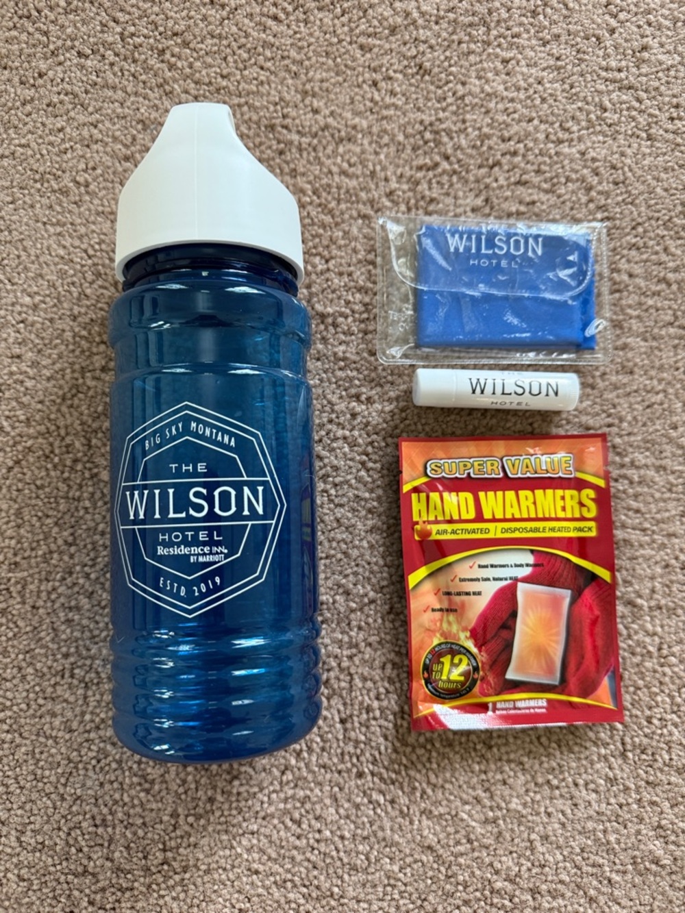 Blue Branded Sports Water Bottle and accessories. The Wilson Big Sky Montana